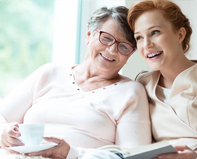 older mother and her daughter smiling after intrathecal baclofen therapy