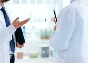 two pharmacists talking to each other