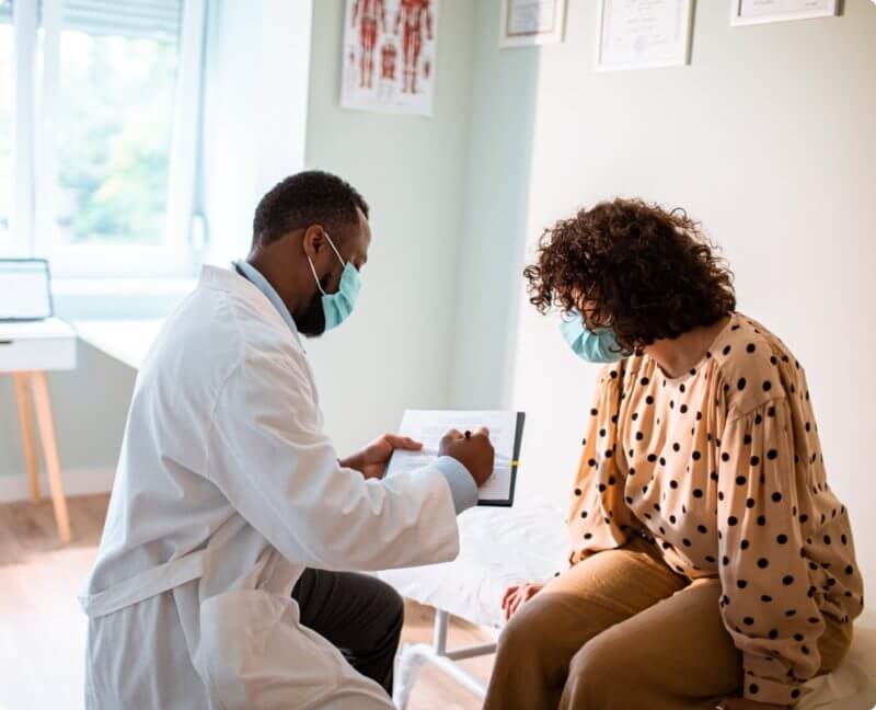 doctor and patient looking at documents