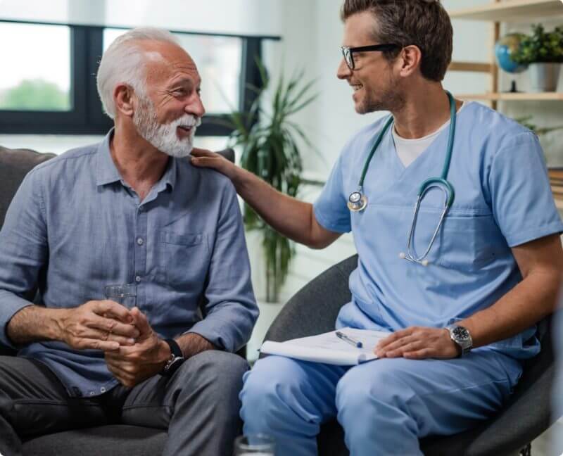 doctor talking with his older male patient