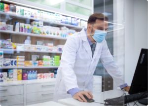 pharmacist looking up a prescription