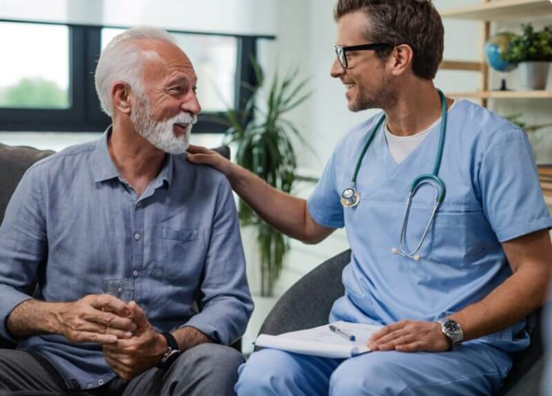 doctor talking with his older male patient